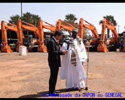 Handing over ceremony (construction equipments and vehicles , 4,500 tons of Japanese rice)